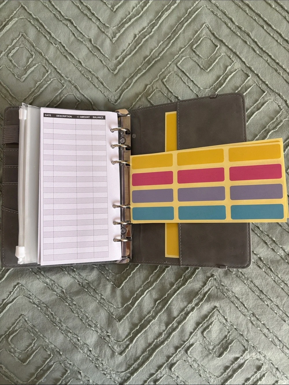 Grey budget binder with zipper pockets and budget tracker sheets